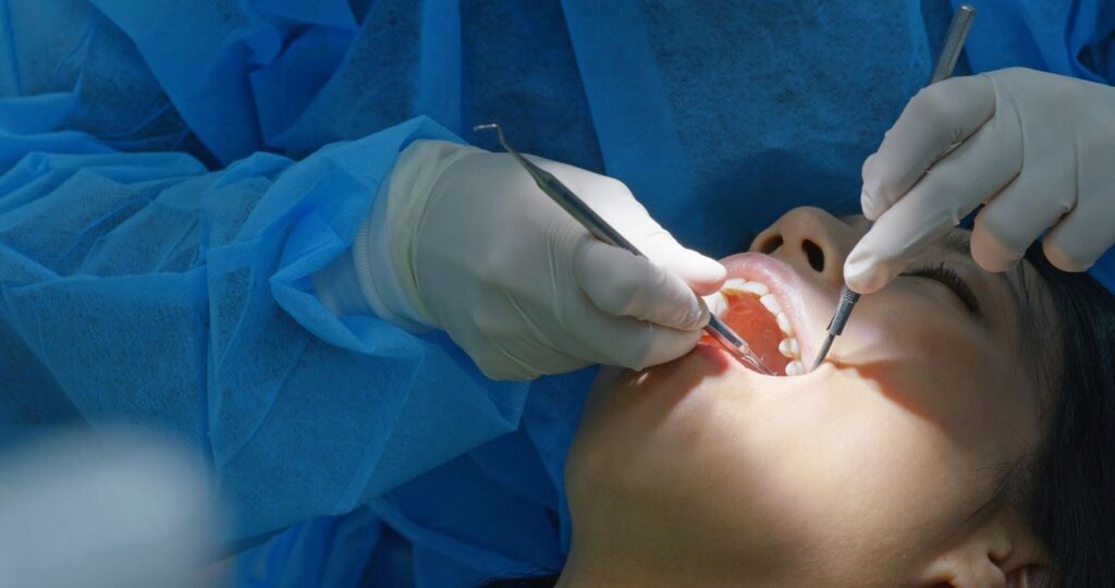 dentist checking if a patient should get a root canal or extraction